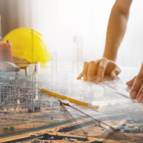 Refinery with overlay of hands reviewing blueprints, representing turnaround planning and facility design